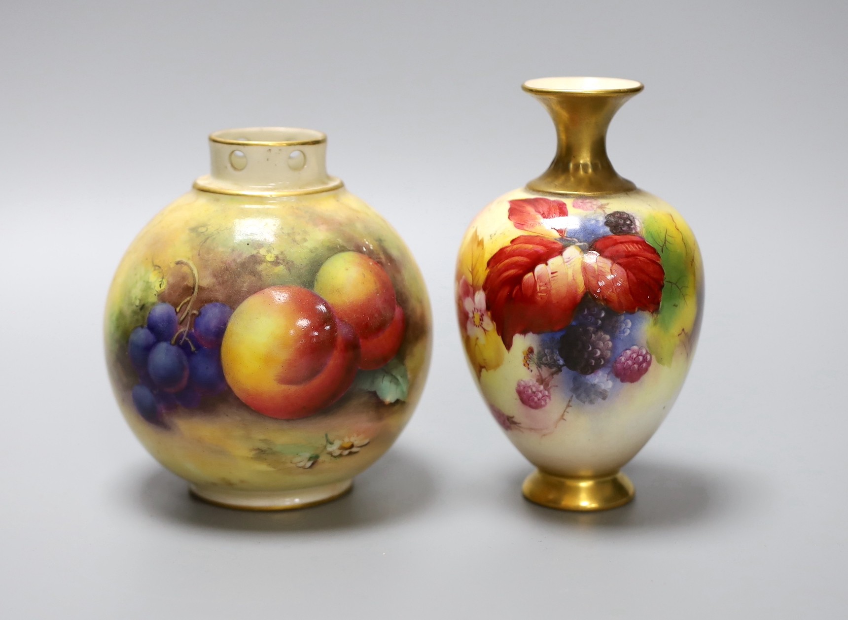 Two hand painted Royal Worcester vases, the taller signed K.Blake, the other signed H.Price, tallest 13cm